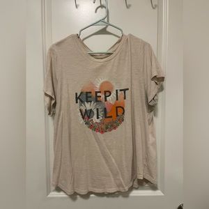 Tan shirt from Old Navy that says “keep it wild”